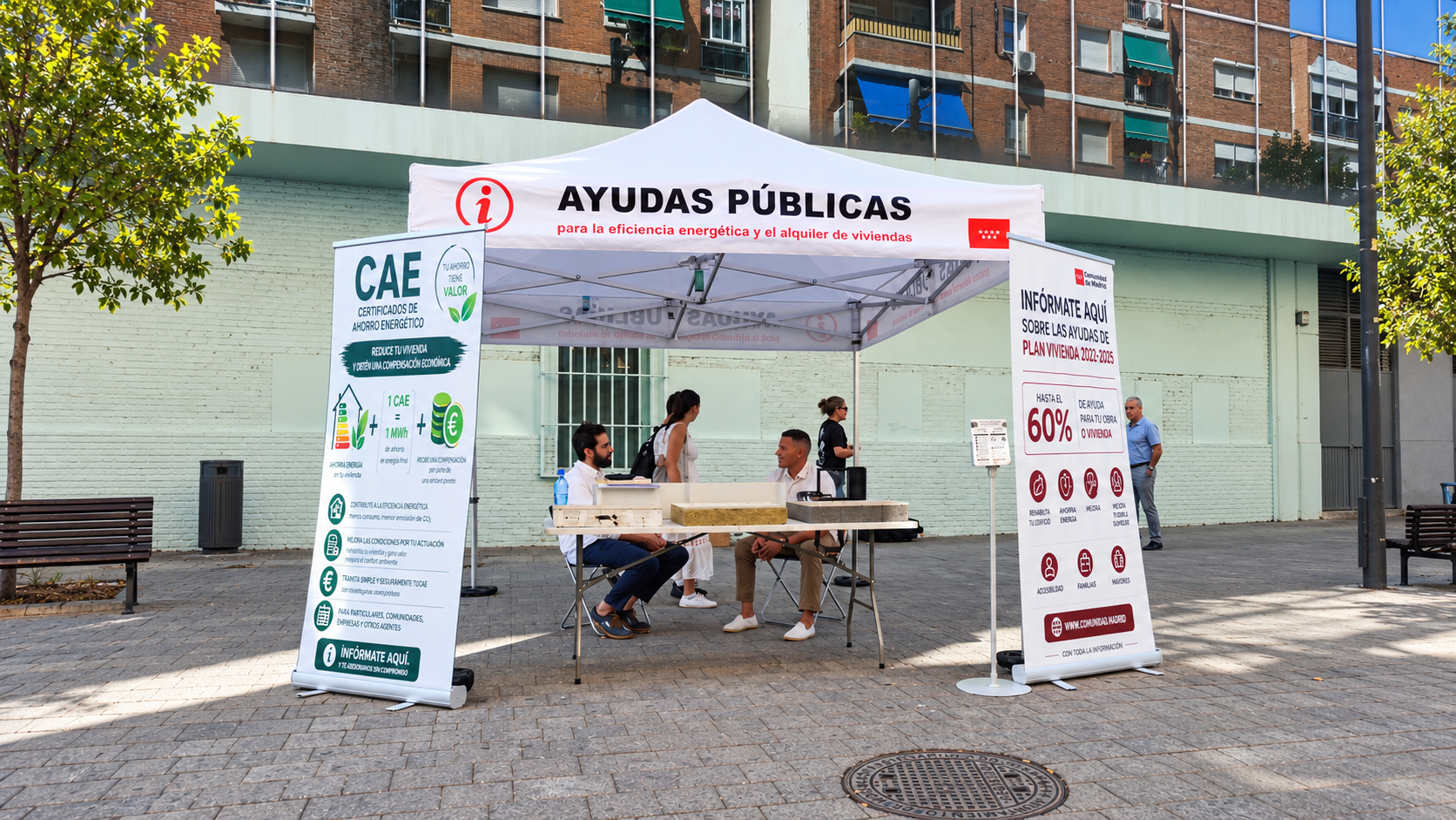 Punto informativo de APMERR con su carpa, rollups y equipo de atención